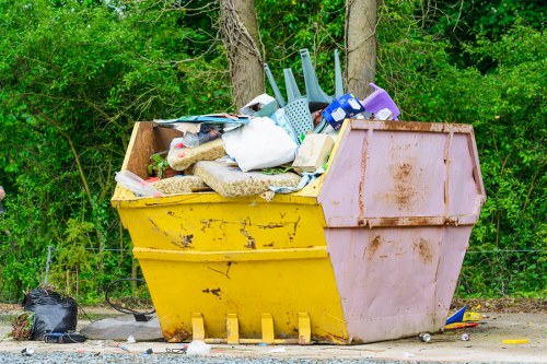Workers preparing for commercial waste removal at a depot