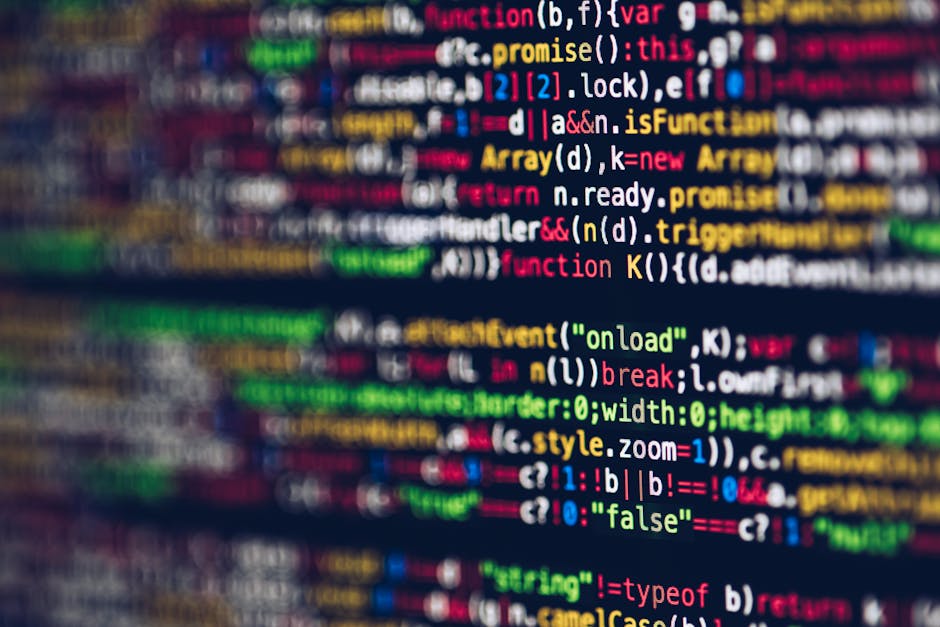 A close-up of a computer screen displaying a colorful array of programming code with various keywords, functions, and syntax highlighted in red, green, blue, yellow, and pink. The code lines are dense